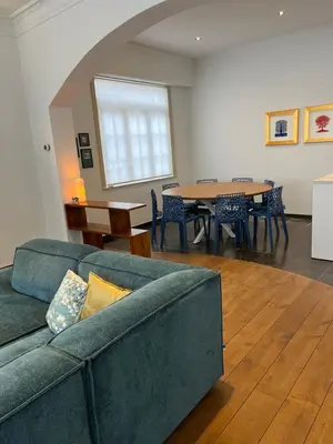 a living room with a couch and a table at Sint-Catharina in Lier