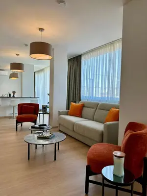 a living room with a couch and a table at Penthouse Grand Place - 2bd - 200sqm Terrace in Brussels