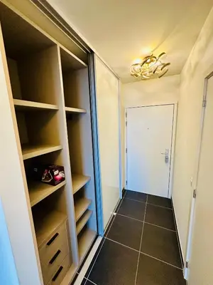 a walk in closet with shelves and a door at Penthouse Grand Place - 2bd - 200sqm Terrace in Brussels