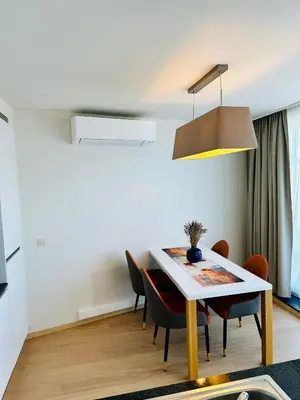 a dining room with a table and chairs at Penthouse Grand Place - 2bd - 200sqm Terrace in Brussels