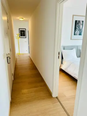 a hallway leading to a bedroom with a bed at Grand Place View - 2bd - Exclusive Apartment in Brussels