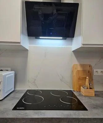 a kitchen with a microwave and a stove top oven at Brussels apartment with terrace 2 in Brussels