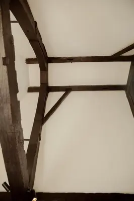 a group of wooden beams on a wall at A Place Antwerp - Boutique Suites & Flats - Oude Koornmarkt 1 in Antwerp