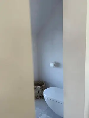 a bathroom with a white toilet in a room at Dakappartement V, 2de verdiep TML in Willebroek