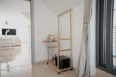 a room with a wooden shelf and a mirror at Penthouse with a Neo-Gothic Parish church view in Ghent