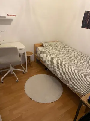 a bedroom with two beds and a desk and a chair at Modern & Cozy Apartment near Tomorrowland- Sleeps 4 in Edegem