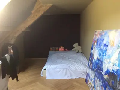 a child laying on a bed with a teddy bear at The Secret Garden in Lankom