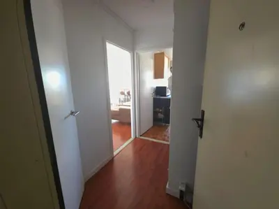 an empty hallway with a door to a room at Bxl central with city views in Brussels