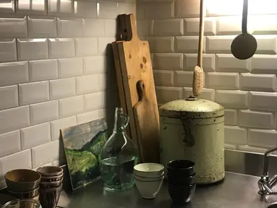 a counter with cups and a bottle on a counter top at The Secret Garden in Herentals