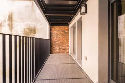a hallway of a building with a brick wall at Heritage Suites Antwerp in Antwerp