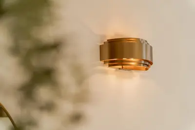 a close up of a light on a wall at Heritage Suites Antwerp in Antwerp