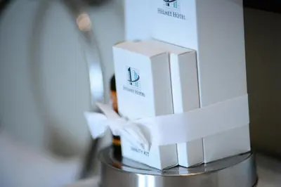 two boxes of wine sitting on top of a table at The Helmet Hotel in Brussels