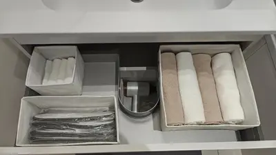 a drawer with towels and paper towels in a bathroom at Highgarden - warm & cozy in Brussels