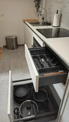 a kitchen with a stove top oven in a drawer at Highgarden - warm & cozy in Brussels
