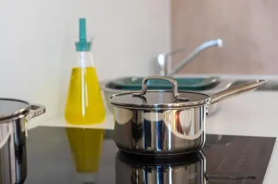 a pot on top of a stove in a kitchen at Stylish 1BR close to KMSKA in Antwerp
