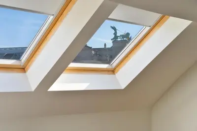a skylight in a ceiling with a statue in the background at Stylish 1BR close to KMSKA in Antwerp