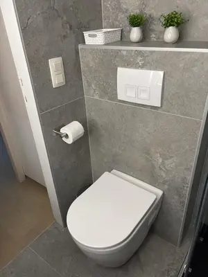 a bathroom with a white toilet in a room at Cozy Loft Grimbergen in Grimbergen