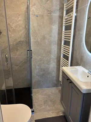 a bathroom with a shower and a sink at Cozy Loft Grimbergen in Grimbergen