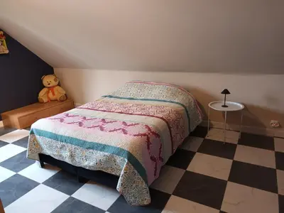 a bedroom with a bed and a teddy bear at Meerdaal in Oud-Heverlee