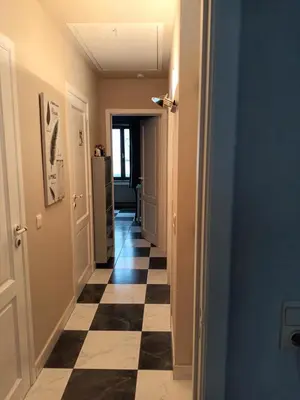 a hallway with a black and white checkered floor at Meerdaal in Oud-Heverlee