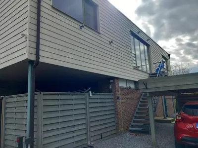 a house with a staircase leading into a garage at Meerdaal in Oud-Heverlee
