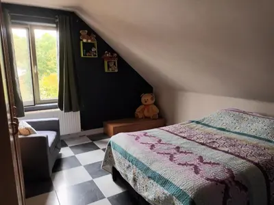 a bedroom with a bed and a teddy bear at Meerdaal in Oud-Heverlee