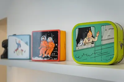 a group of small boxes sitting on a shelf at Fully furnished and modern flat - Brussels center in Brussels