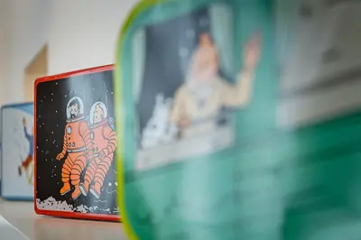 a coffee cup with a picture of an astronaut at Fully furnished and modern flat - Brussels center in Brussels