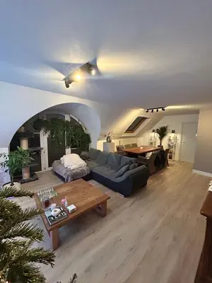 a living room with a couch and a table at Tomorrowland 2026 Rooftop-Fireworks View in Boom