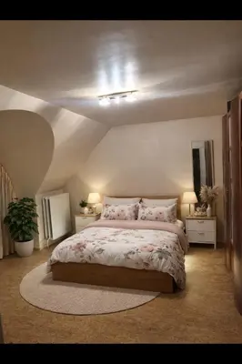 a bedroom with a large bed with two night stands at Tomorrowland 2026 Rooftop-Fireworks View in Boom