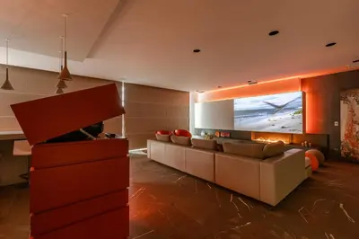 a living room with a couch and a television at Villa Gentbos - currently 15beds 3bathrooms - from june 2026 up to 21beds 6bathrooms in Pataterhoek