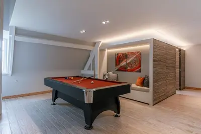 a room with a pool table and a painting at Villa Gentbos - currently 15beds 3bathrooms - from june 2026 up to 21beds 6bathrooms in Pataterhoek
