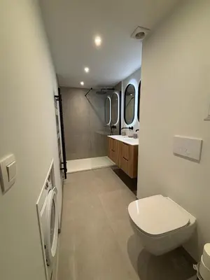 a bathroom with a toilet and a sink at Studio Vleurgat in Brussels