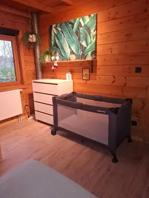 a room with a bed and a tv on the wall at Innersoulhouse in Wuustwezel