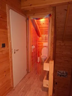a bathroom with a shower and a toilet in a room at Innersoulhouse in Wuustwezel