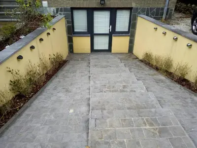 a walkway leading to a house with a door at relaxation in Waterloo, 2 steps from the center of Brussels in Waterloo