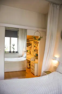 a bedroom with two beds and a window at The Golden Hour Loft in Brussels