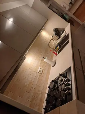 an overhead view of a kitchen with a stove at Cosy -confort appartment in Antwerp
