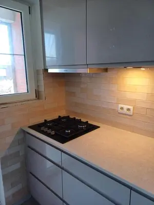 a stove top in a kitchen with a window at Cosy -confort appartment in Antwerp