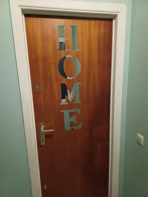 a brown door with the word exit on it at Cosy -confort appartment in Antwerp