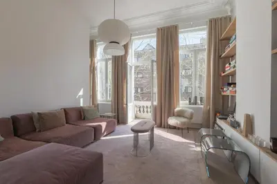 a living room with a couch and a chair at Southside Suites in Antwerp