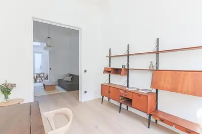 a living room with a desk and a table at Southside Suites in Antwerp