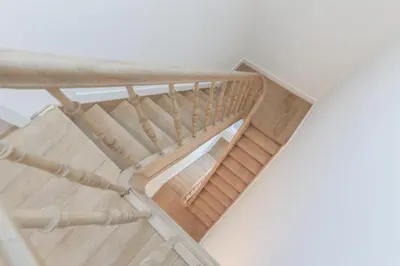an overhead view of a wooden staircase with a wooden ceiling at Southside Suites in Antwerp