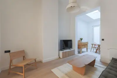 a living room with a couch and a table at Southside Suites in Antwerp