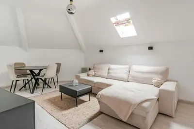 a living room with a couch and a table at Elegant Stay in Châtelain Ixelles in Brussels