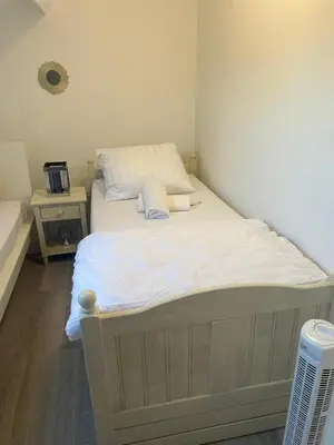 a bed with two pillows on it in a room at Only For Tomorrowland in Boom