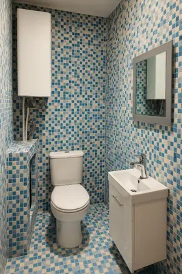a bathroom with a toilet and a sink at Cosy studio Midi station in Brussels