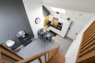 an overhead view of a kitchen and living room at Cocon douillet à Bruxelles in Brussels