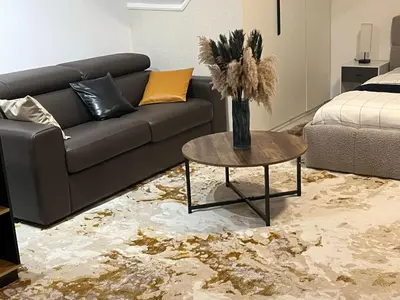 a living room with a couch and a table at Luxe Villa Lou & Hans in Aalst