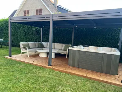 a gazebo with a hot tub on a deck at Luxe Villa Lou & Hans in Aalst